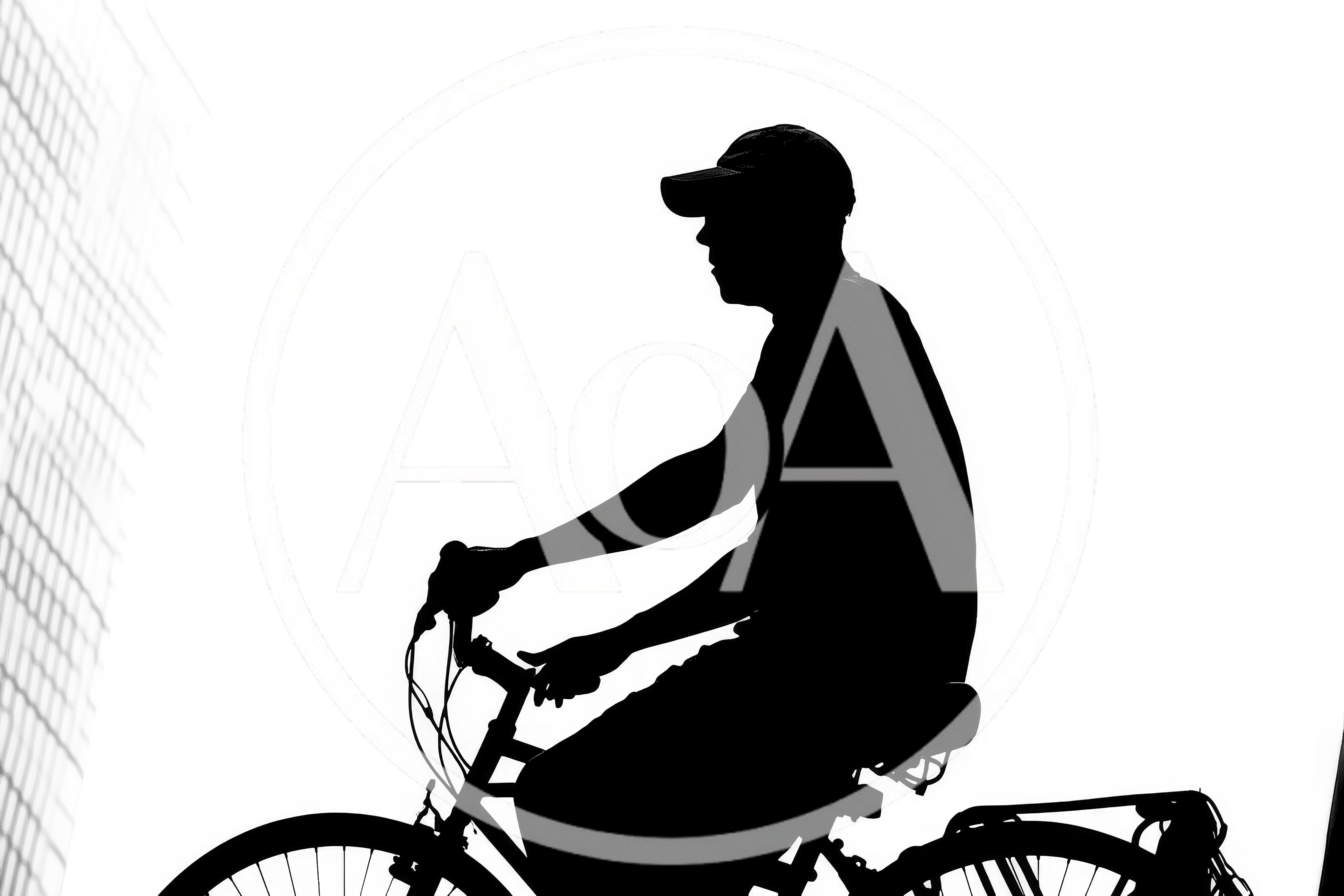 Silhouette Of A Man Riding A Bicycle