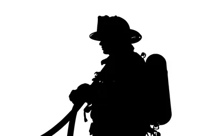 Silhouette Of A Firefighter Holding A Hose