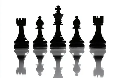 Silhouette Of Chess Pieces On Reflective Surface