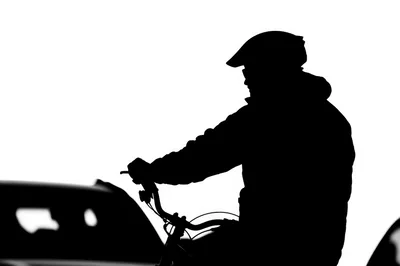 Silhouette Of A Cyclist Riding A Bicycle