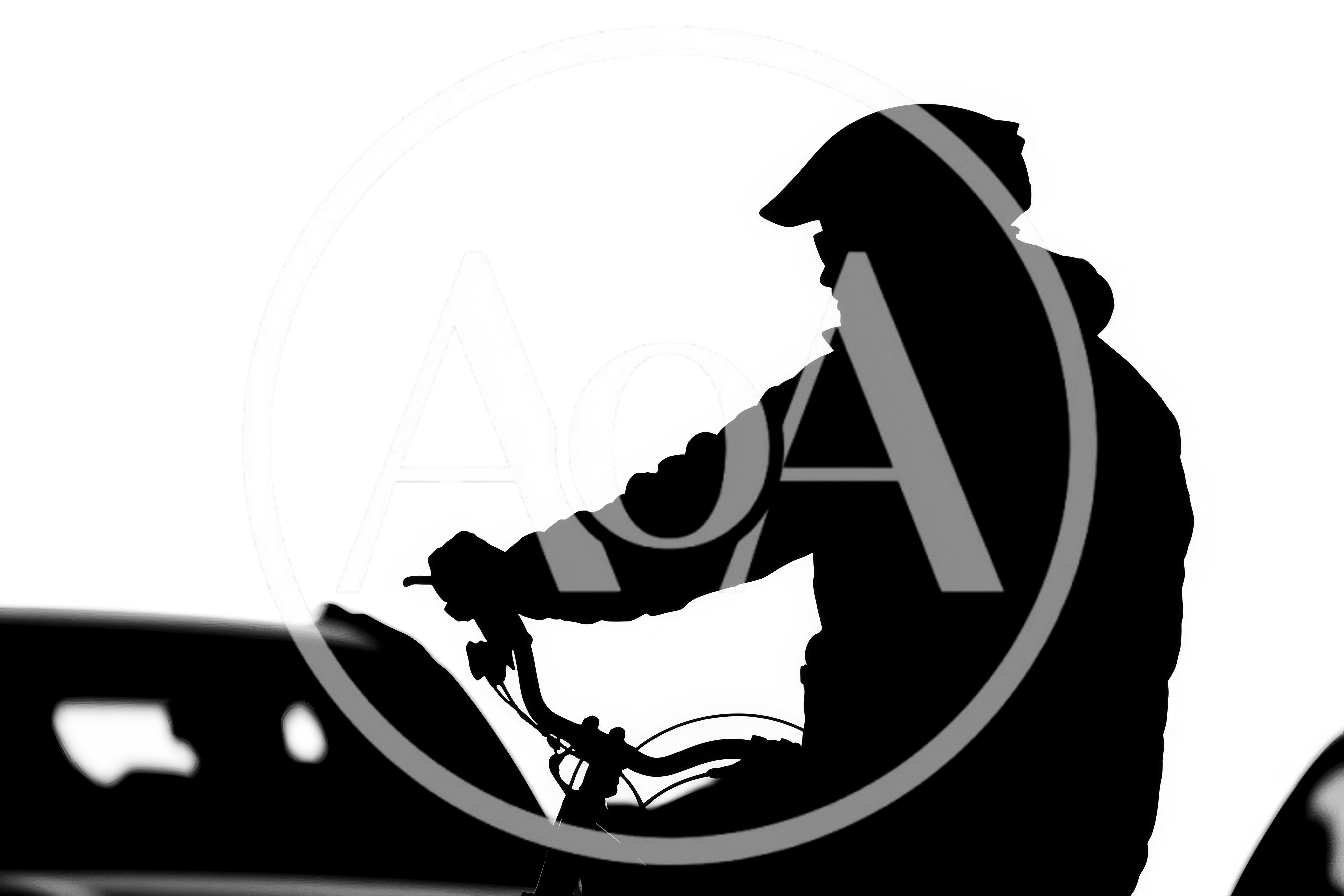 Silhouette Of A Cyclist Riding A Bicycle