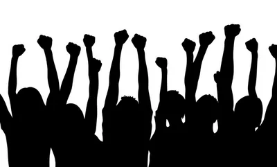Silhouettes of People Raising Fists in Protest
