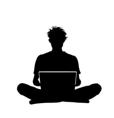Silhouette Of A Person Sitting Cross Legged Using Laptop