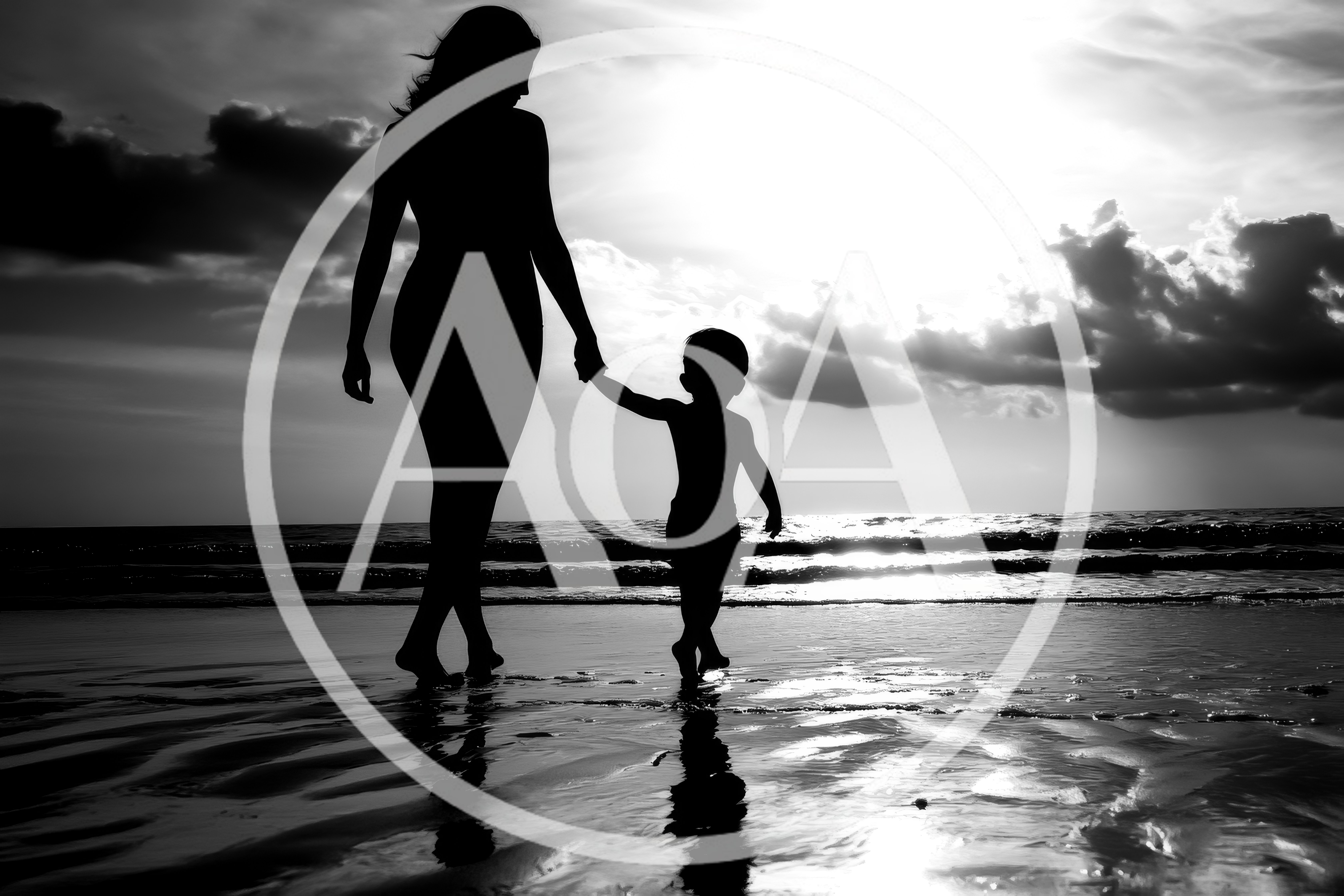 Mother And Child Walking Hand In Hand On Beach
