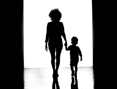 Silhouette Of A Mother And Child Walking Together