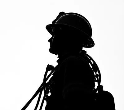 Silhouette Of A Firefighter In Protective Gear