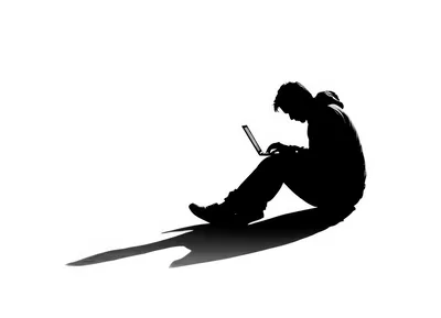 Silhouette Of A Person Working On A Laptop