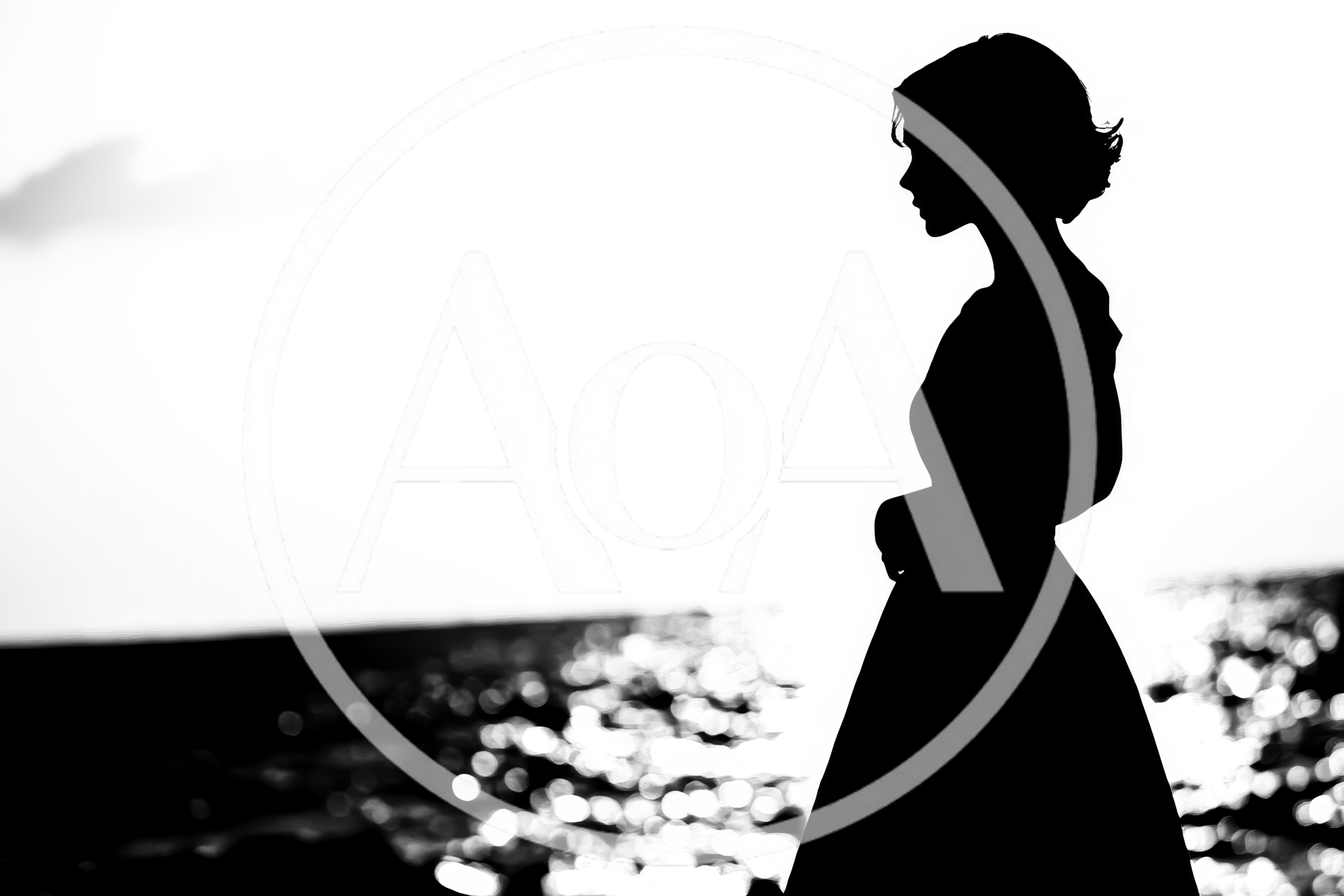 Silhouette Of A Woman Standing By The Sea