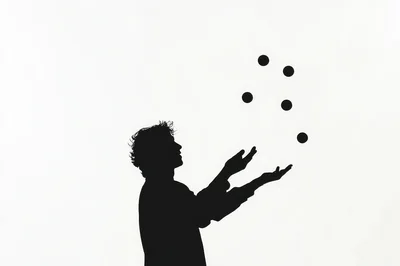 Silhouette Of A Man Juggling Five Balls