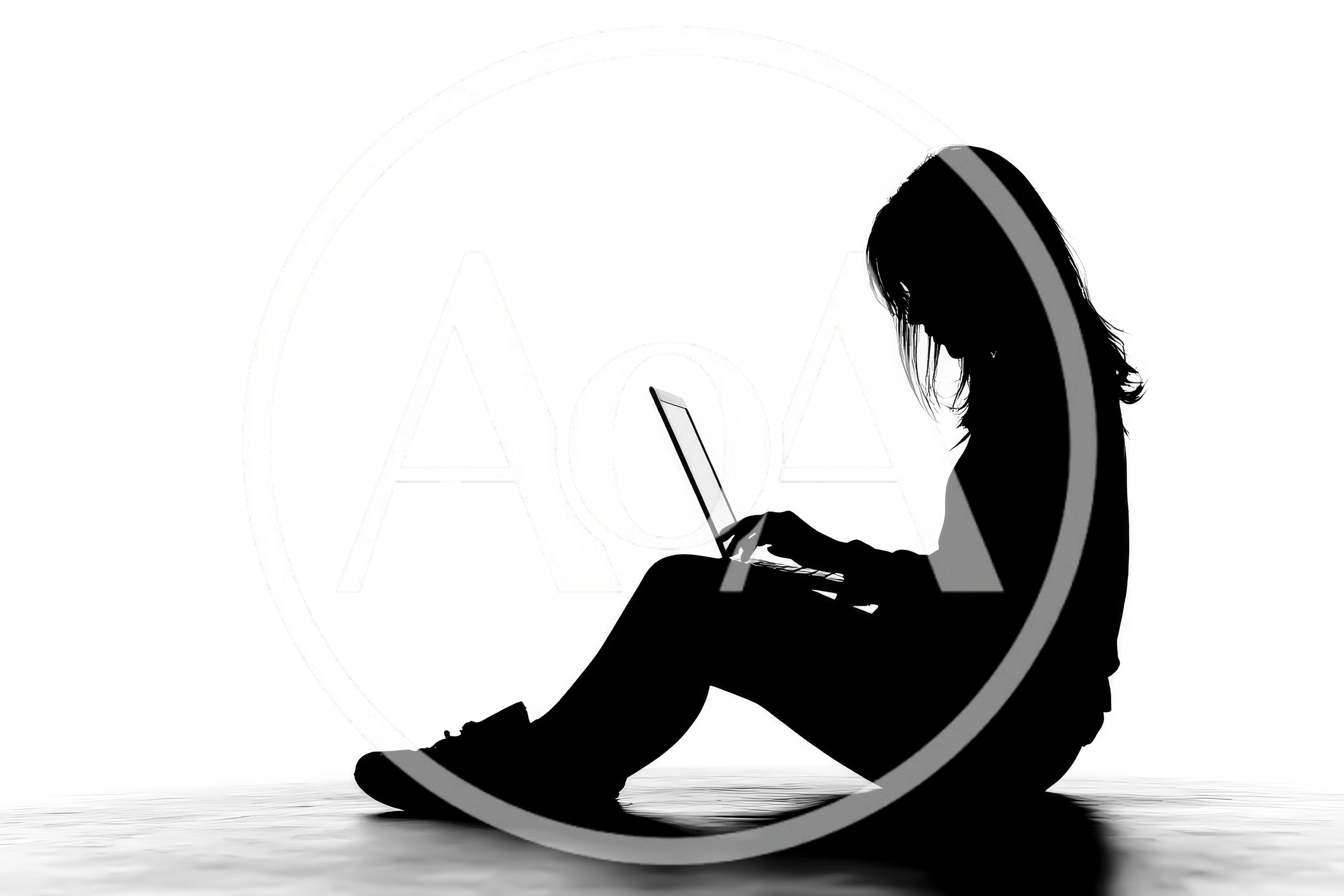 Silhouette Of A Woman Sitting And Using A Laptop