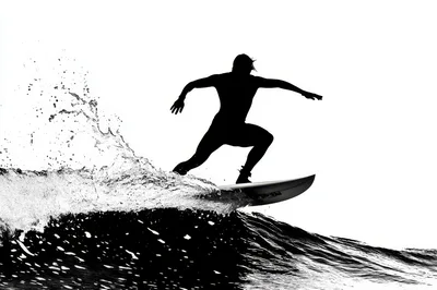 Silhouette Of A Surfer Riding A Wave