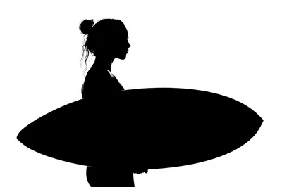 Silhouette Of A Woman Holding A Surfboard