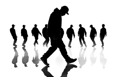 Silhouettes Of Men Walking In A Row