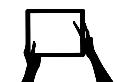 Silhouette Of Hands Holding A Tablet Computer