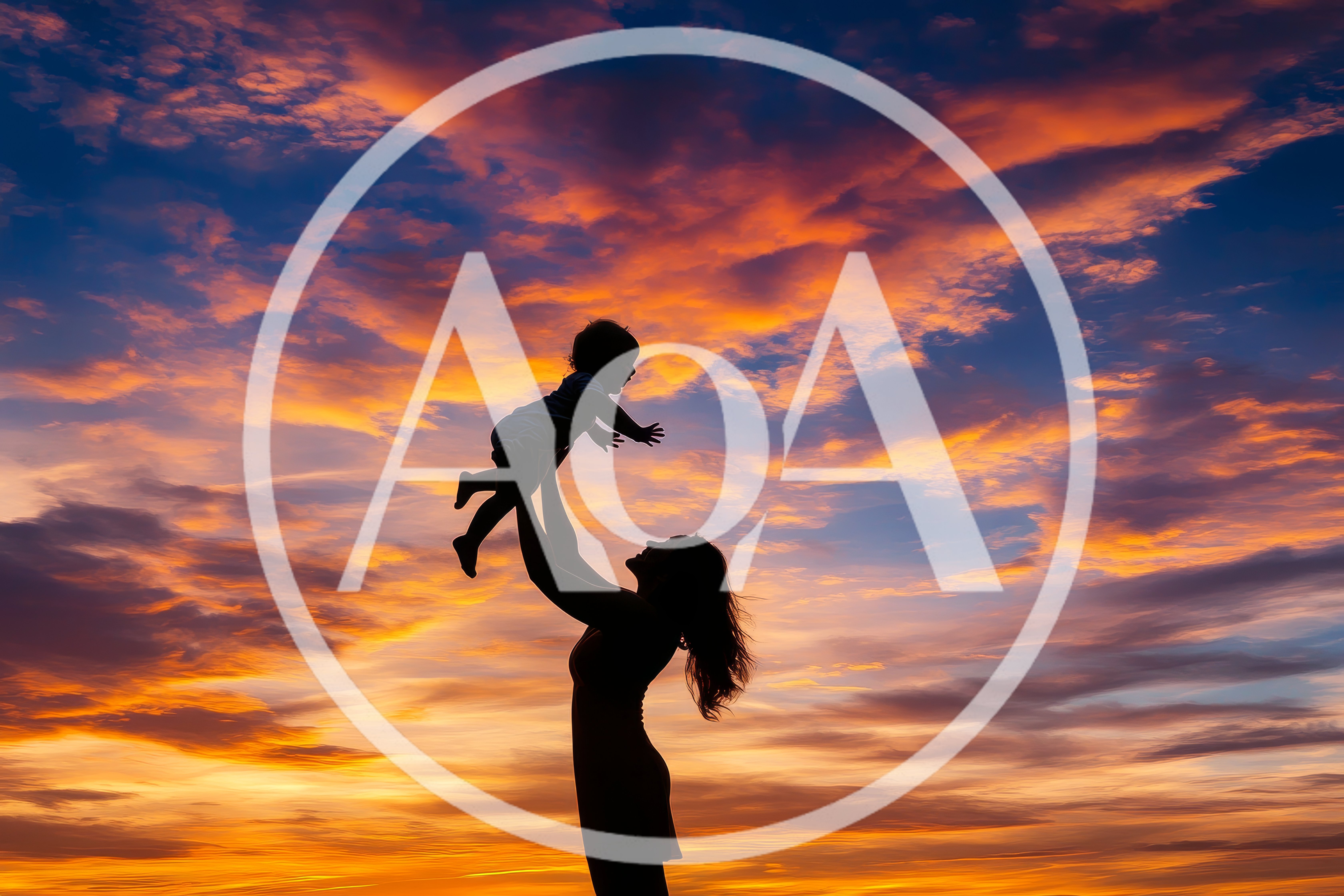 Mother Lifting Her Child Against A Vibrant Sunset