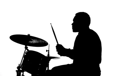 Silhouette Of A Drummer Playing Drums