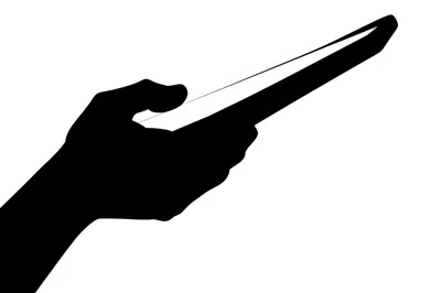 Silhouette Of A Hand Holding A Tablet Device