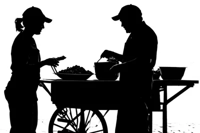 Silhouette Of Street Food Vendors Preparing Meals
