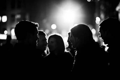 Group Of Friends Socializing At Night In The City