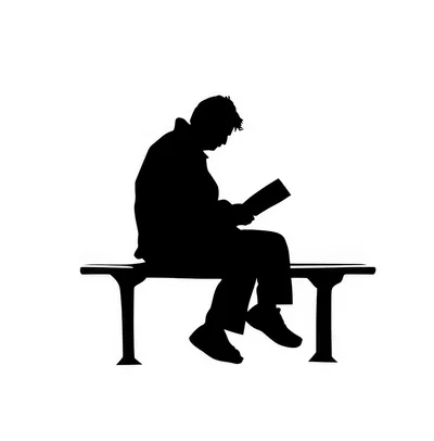 Silhouette of a Person Sitting on a Bench Reading