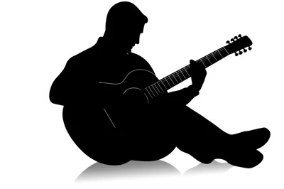 Silhouette Of A Man Playing Acoustic Guitar