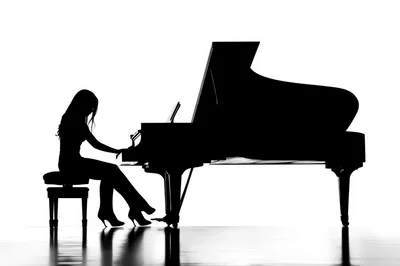 Silhouette Of A Woman Playing A Grand Piano