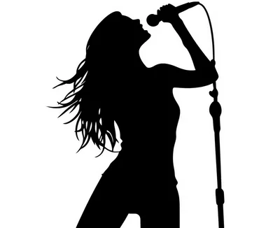 Silhouette Of A Female Singer Performing With A Microphone