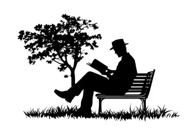 Silhouette Of A Man Reading On A Park Bench