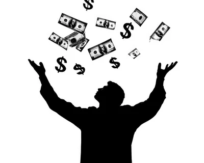 Silhouette Of A Man Reaching For Falling Money