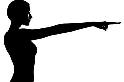 Silhouette of a Woman Pointing to the Right