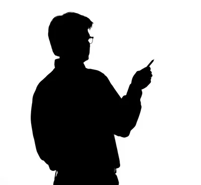 Silhouette Of A Man Holding A Pen