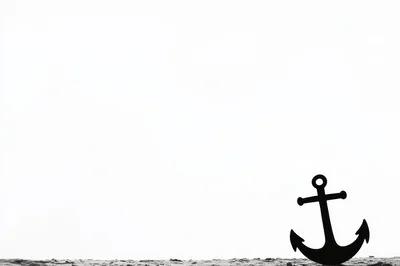 Black Anchor Silhouette Against A Bright White Background