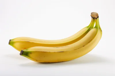 Two Fresh Yellow Bananas on White Background