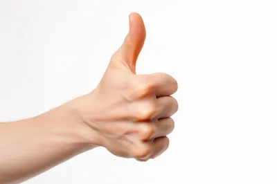 Human Hand Showing Thumbs Up Gesture