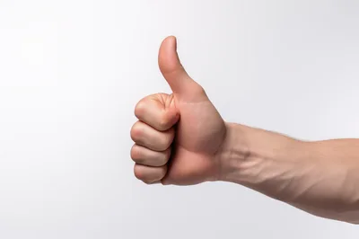 Human Hand Showing Thumbs Up Gesture