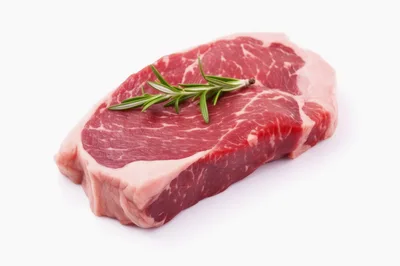 Raw Beef Ribeye Steak With Fresh Rosemary Sprig