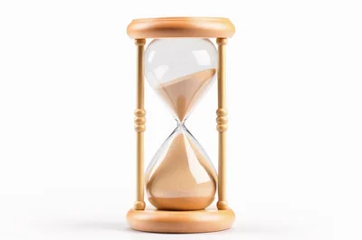 Wooden Hourglass With Flowing Sand On White Background