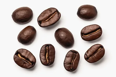 Top View Of Roasted Coffee Beans On White Background