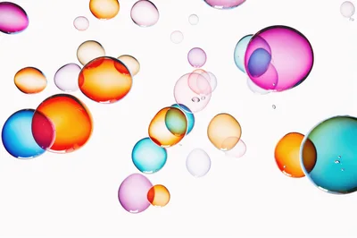 Colorful Floating Liquid Spheres On White Background