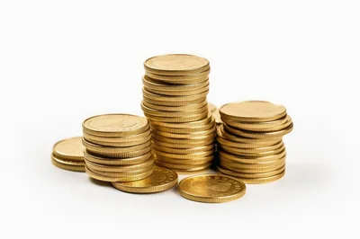Stacks Of Shiny Gold Coins On White Background