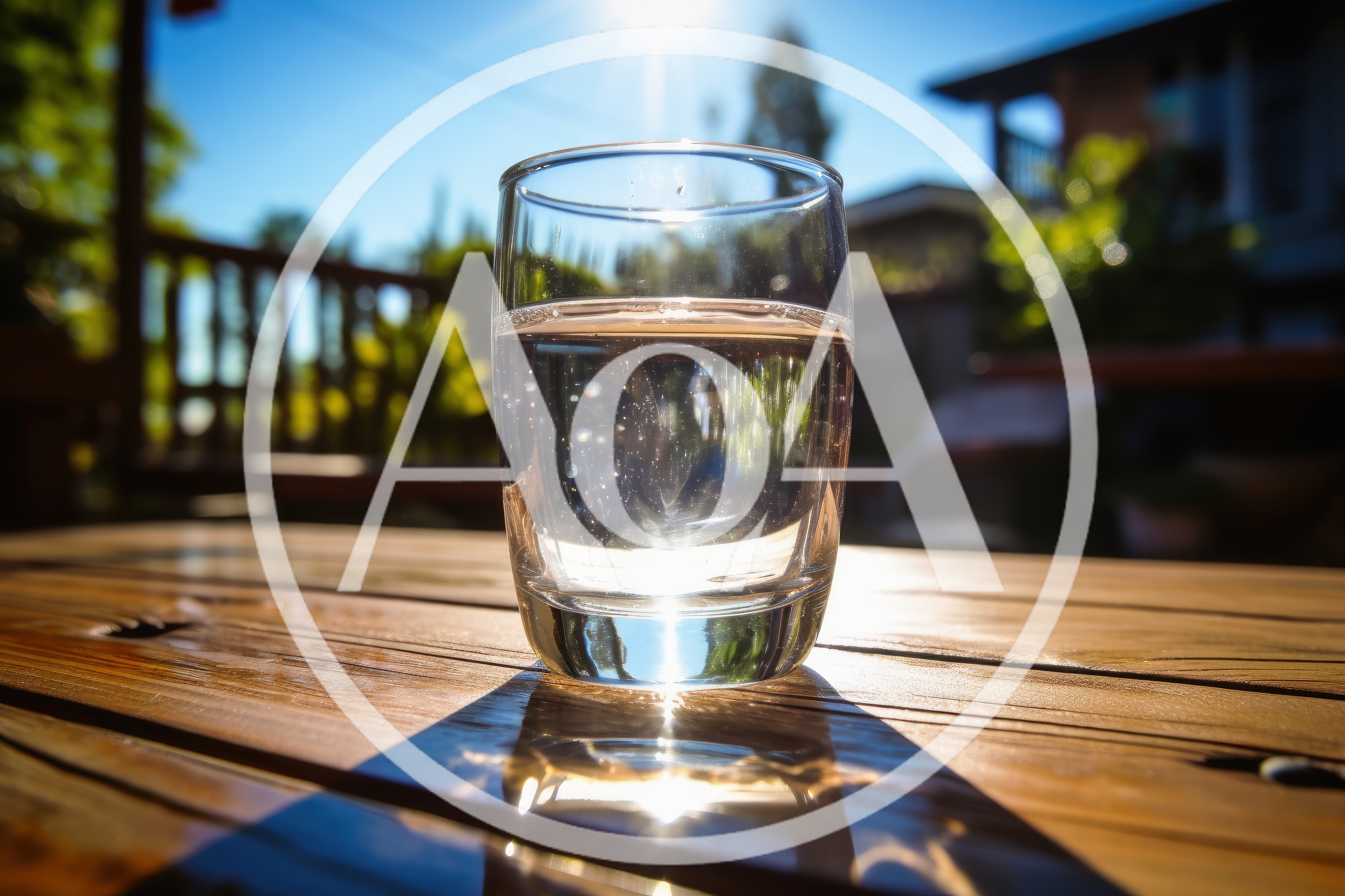 Glass Of Water On A Wooden Table Outdoors