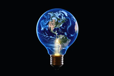 Earth Globe Inside A Glowing Light Bulb