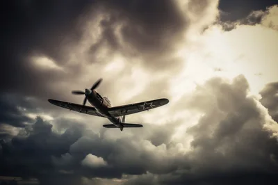 Vintage Soviet Fighter Plane Flying Through Stormy Clouds