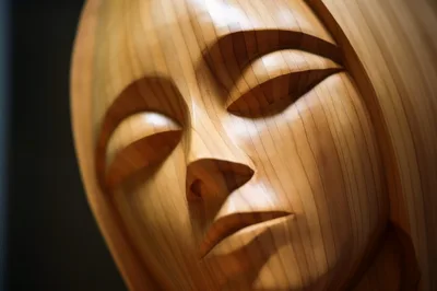 Close Up Of A Wooden Sculpted Human Face