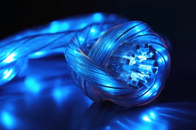 Fiber Optic Cable Bundle Glowing With Blue Light