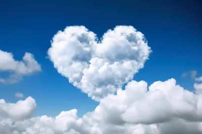 Heart Shaped Cloud Floating In A Clear Blue Sky