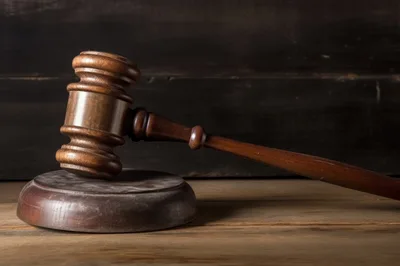 Wooden Judge Gavel Resting On A Sounding Block