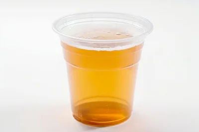 Plastic Cup Filled With Golden Beer