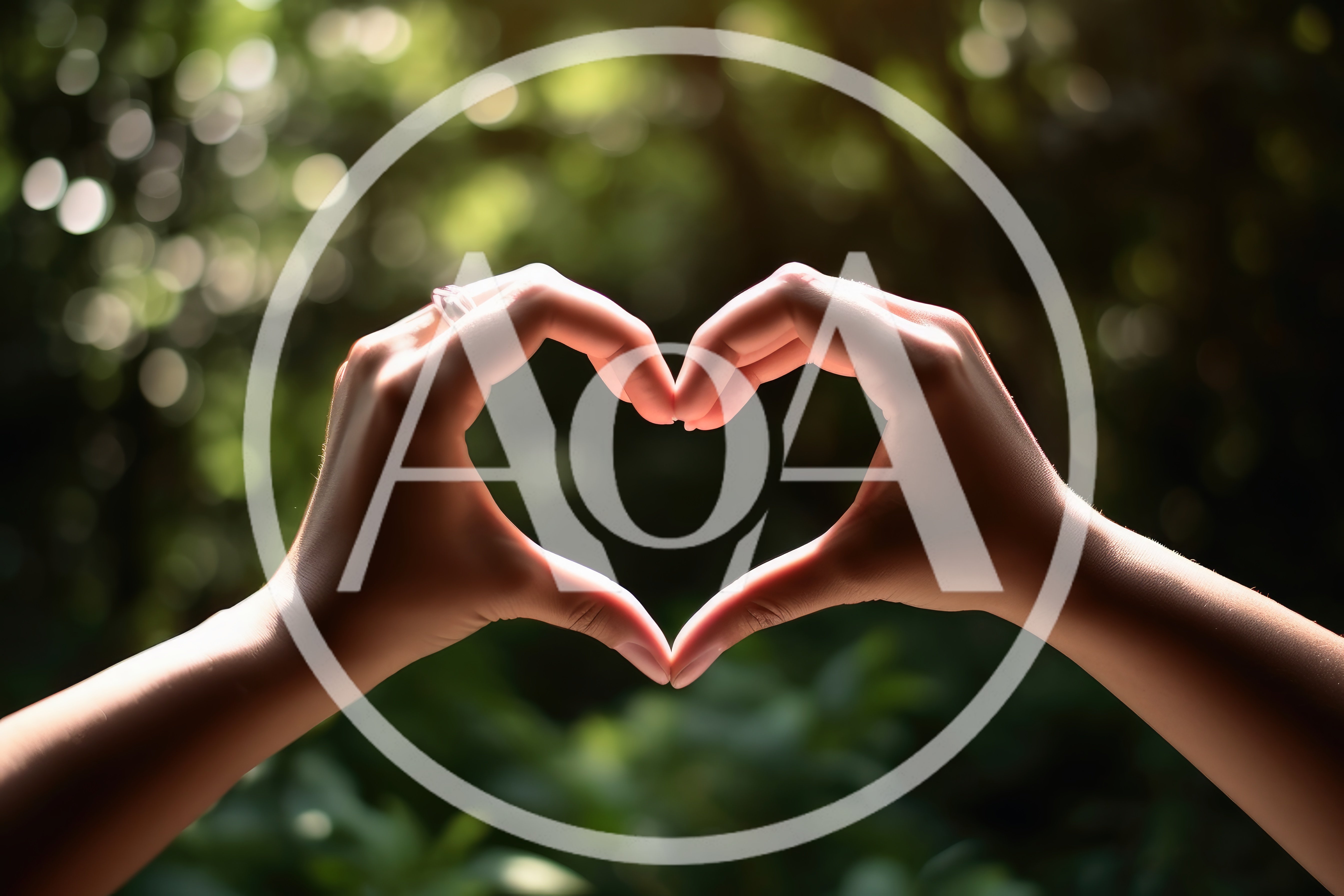 Hands Forming A Heart Shape Against Blurred Greenery