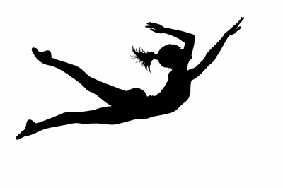 Silhouette Of A Female Gymnast Performing A Leap